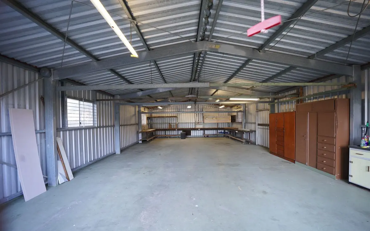 Empty metal building interior with a concrete floor
